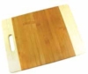 Two tone bamboo cutting board with cut handle